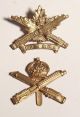 Machine Gun Corps cap badges (2)