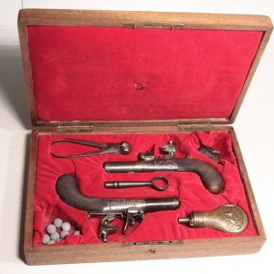 Cased pair of flintlock pocket pistols Hill, London